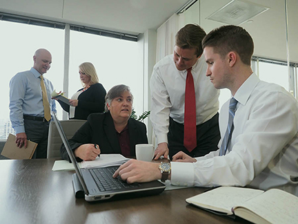 turtle creek management team dallas working together in office professionals men wearing ties while working in office building investment company dallas texas